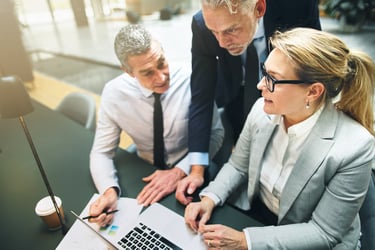 mature-manager-discussing-business-with-two-collea-2021-08-27-11-10-44-utc-op mature-manager-discussing-business-with-two-collea-2021-08-27-11-10-44-utc-op